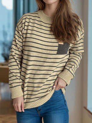 Tan and dark gray striped knit sweater with asymmetrical pocket detail.