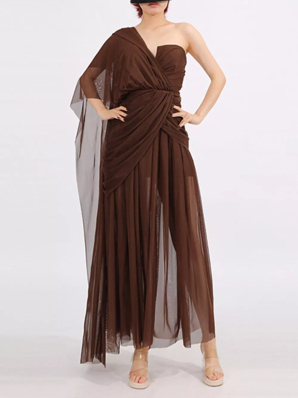 Draped one-shoulder maxi dress in coffee brown with sheer overlay and ruched waist.