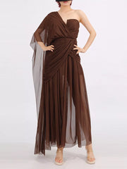 Draped one-shoulder maxi dress in coffee brown with sheer overlay and ruched waist.