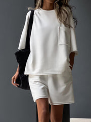 Raw-edge pocket tee & Bermuda shorts set in white or sage.