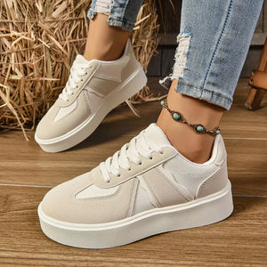 Beige panelled platform sneakers with contrast details and white laces.