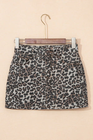 Denim mini skirt in leopard print with button and zip closure.