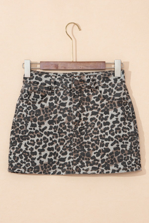 Denim mini skirt in leopard print with button and zip closure.