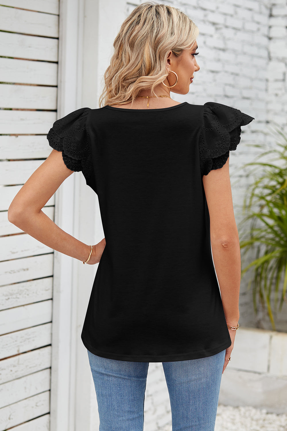 Black eyelet flutter sleeve square neck blouse with casual styling.