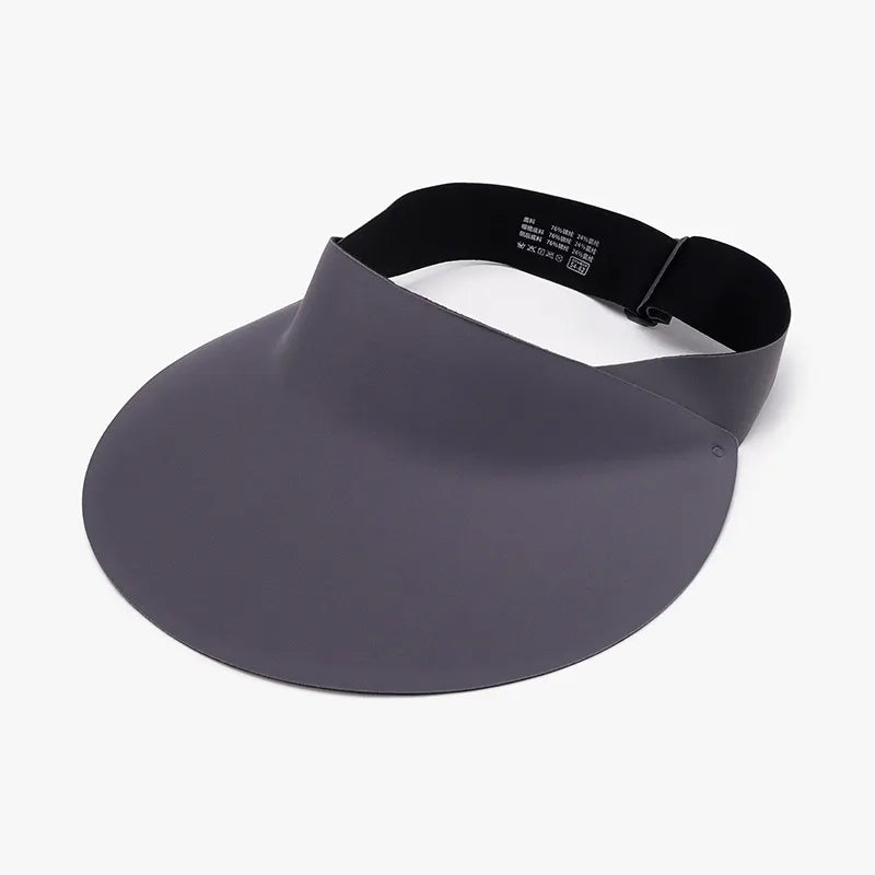 Sculptural visor sun shield in dark gray with adjustable black band.