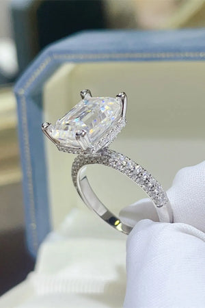 Emerald cut moissanite ring with pave band in silver