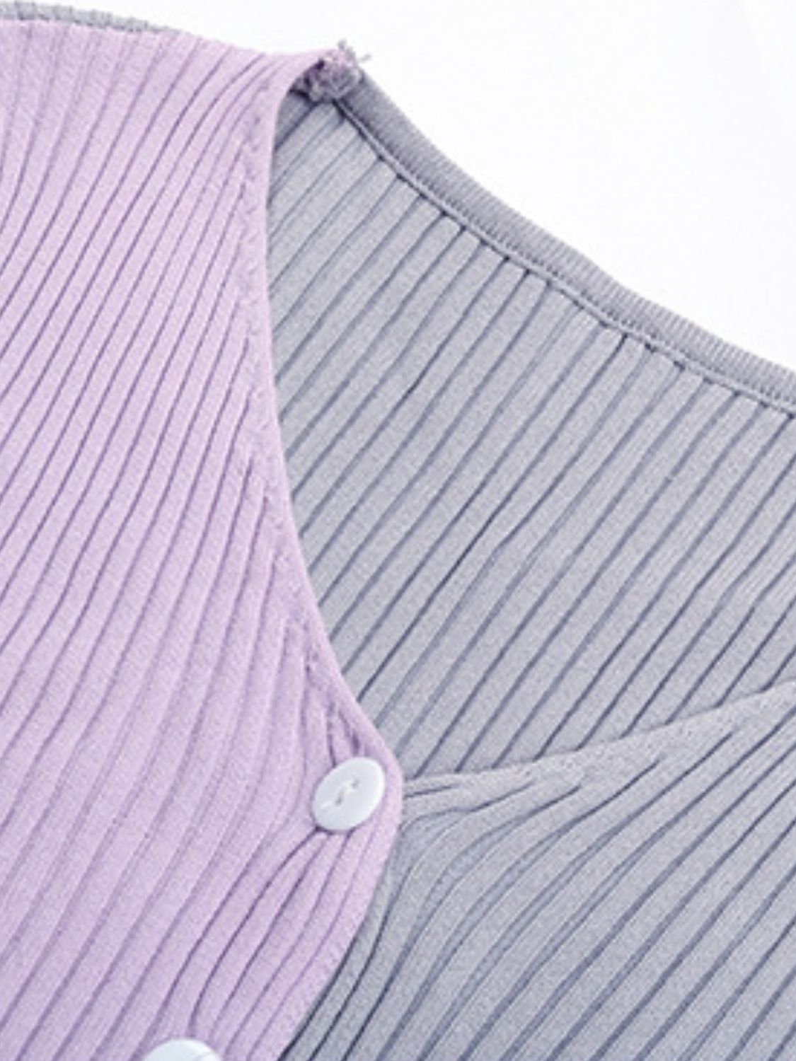 Colorblock ribbed cropped cardigan in lavender and gray with white buttons.