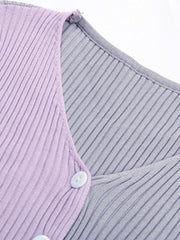 Colorblock ribbed cropped cardigan in lavender and gray with white buttons.