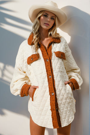 Diamond quilted shacket in cream with contrast trim and buttoned pockets.