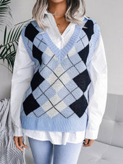 Light blue argyle knit v-neck sweater vest with ribbed trim, worn over a white shirt.