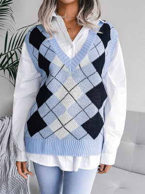 Light blue argyle knit v-neck sweater vest with ribbed trim, worn over a white shirt.