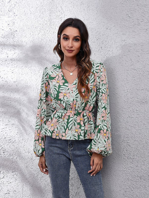 Green tropical print peplum blouse with V-neck and balloon sleeves