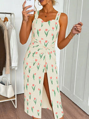 Cream tulip print midi dress with twist front and thigh slit.