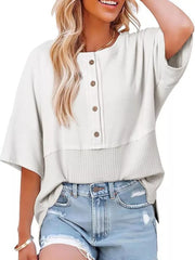 White waffle-knit t-shirt with button detail and contrasting textured hem.