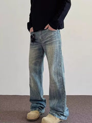 Men's vintage wash wide leg jeans in blue cotton, featuring a relaxed fit and classic style.