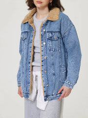 Sherpa-lined oversized acid wash denim trucker jacket with a collar.