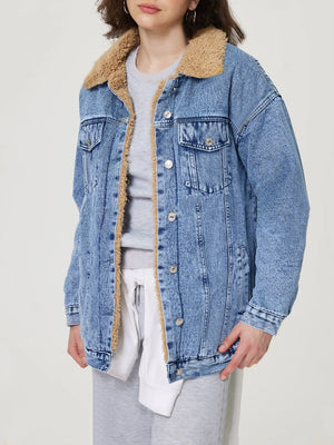 Sherpa-lined oversized acid wash denim trucker jacket with a collar.