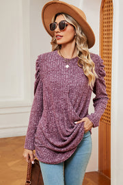 Textured drape sleeve top in dusty rose with ruched shoulder detail and crossover front.