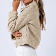 Sand textured sherpa cropped jacket with collar and pocket detail.