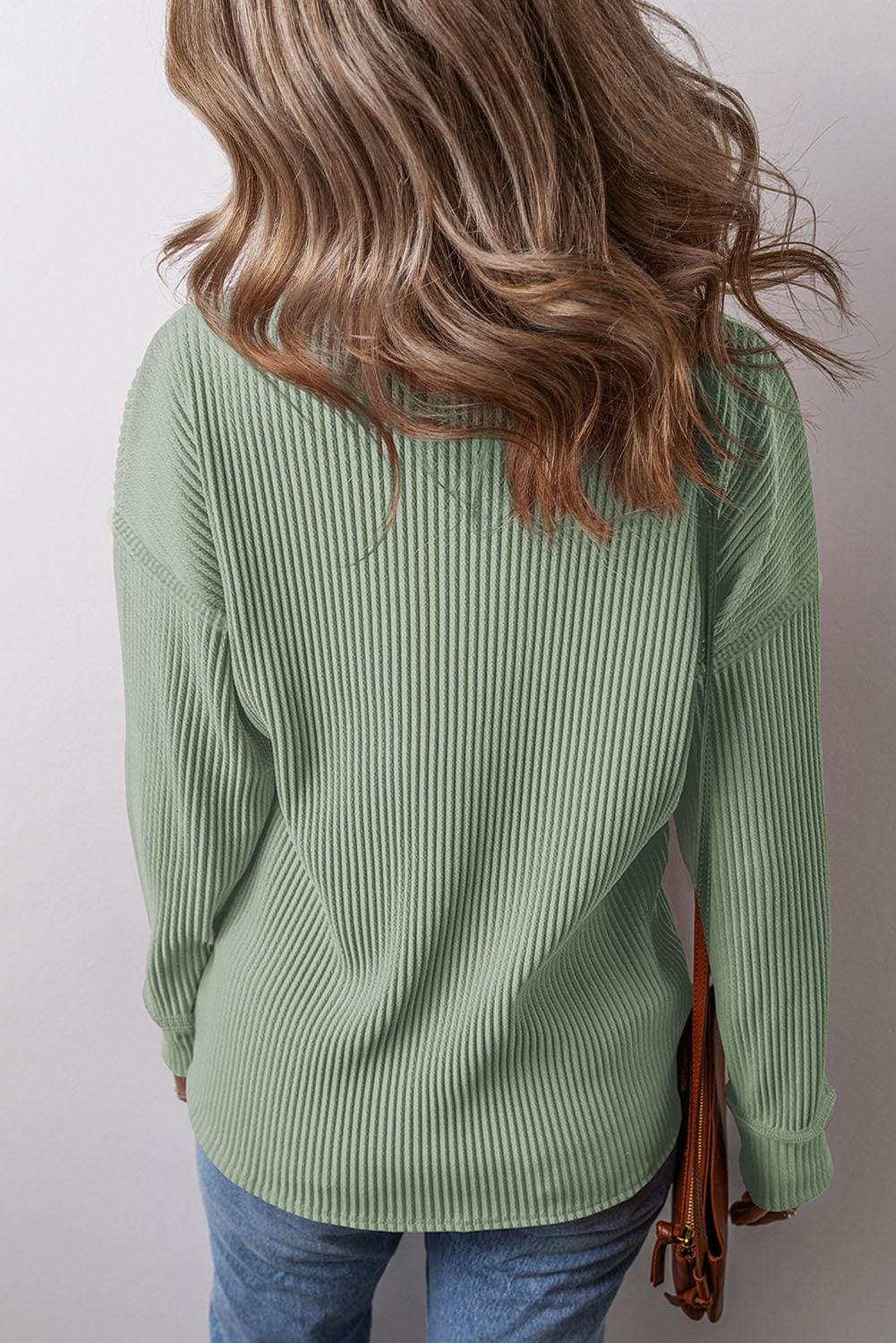 Sage ribbed knit long sleeve top with a casual relaxed fit.