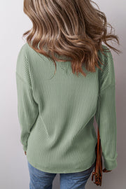 Sage ribbed knit long sleeve top with a casual relaxed fit.