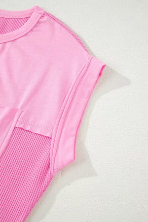 Pink polyester t-shirt with waffled texture and seam detail
