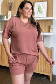 Light Mauve ribbed knit outfit set with short sleeve top and drawstring shorts.