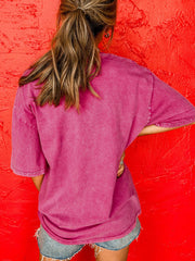 Pink graphic cotton t-shirt with short sleeves and a relaxed fit.