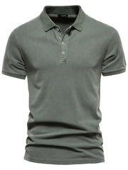 Sage green textured polo shirt with short sleeves and buttoned placket.