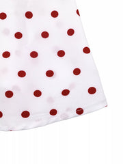 White polyester camisole with red polka dots and ruched detail.