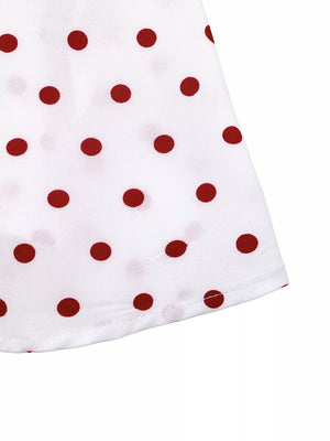 White polyester camisole with red polka dots and ruched detail.