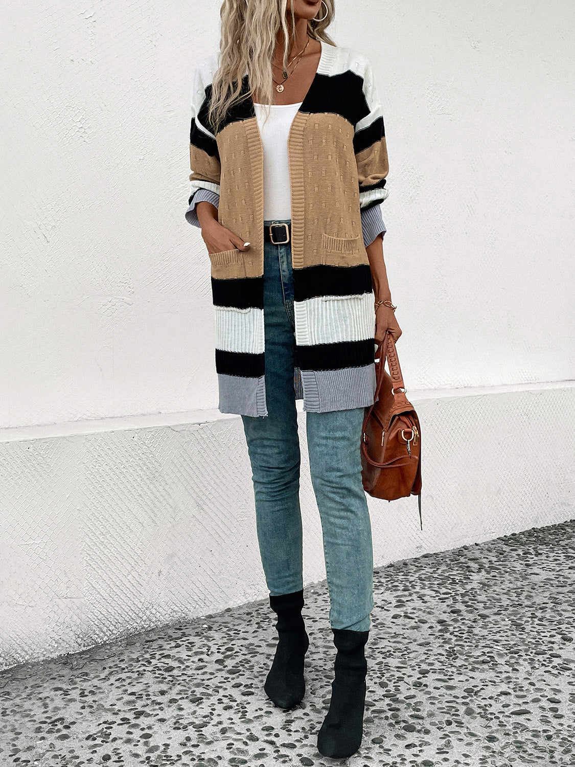 Textured stripe open-front cardigan in camel, black, white, and gray acrylic with pockets.