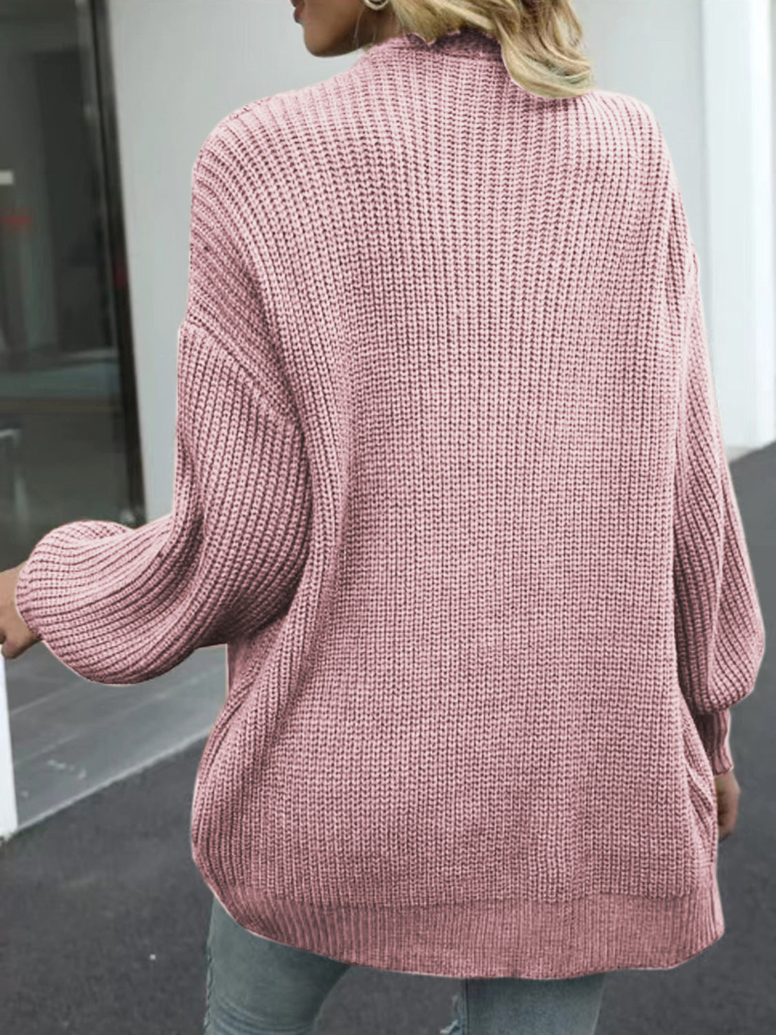 Dusty pink chunky knit cocoon cardigan with balloon sleeves and ribbed texture.
