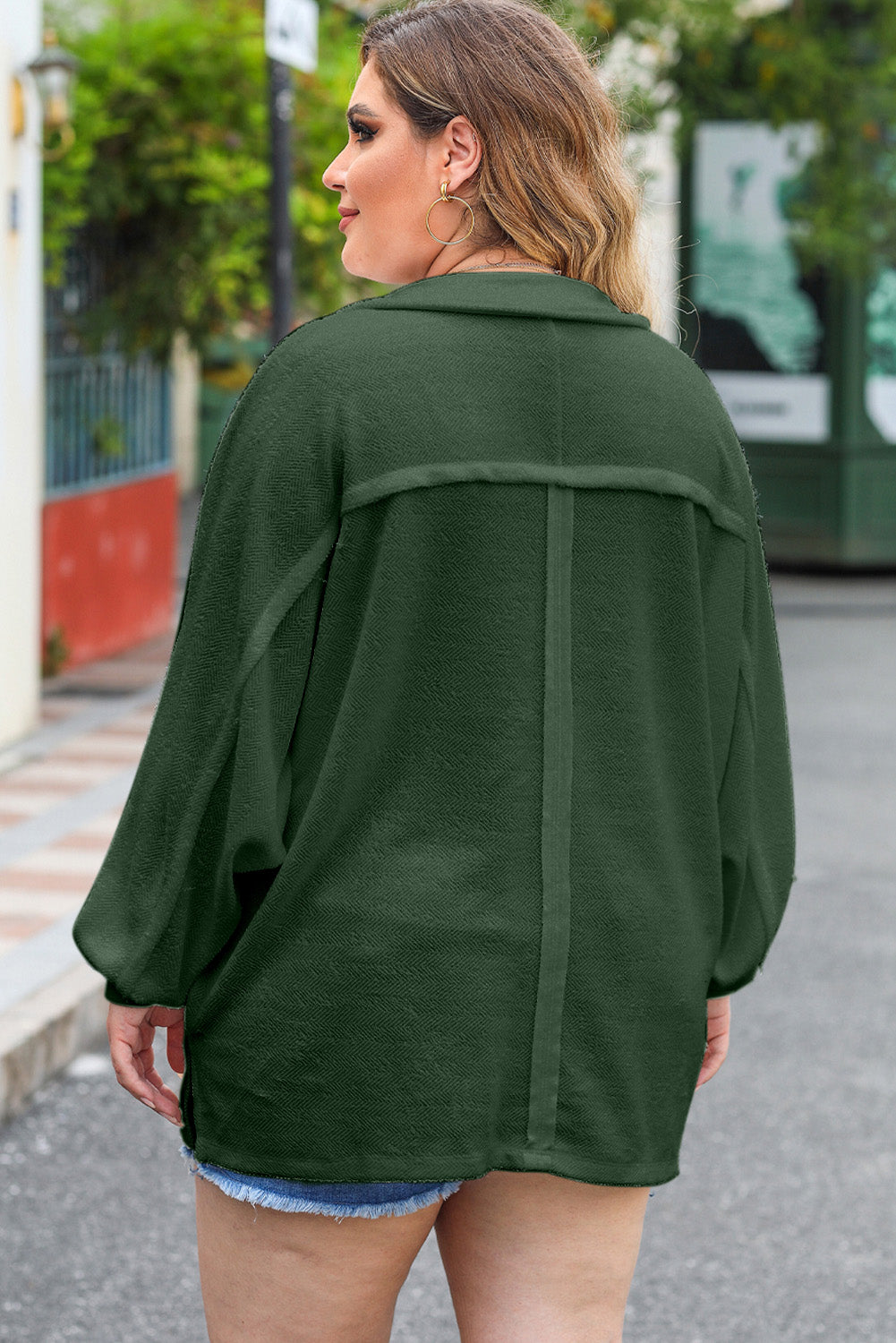 Green textured oversized button-down shirt with a herringbone pattern and dropped shoulders.