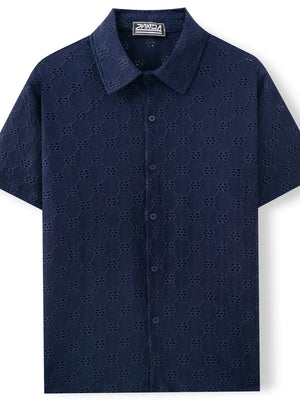 Navy geometric eyelet short sleeve resort shirt with button front and collar.