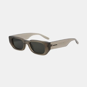 Smoked acetate angular sunglasses with dark lenses and a taupe finish.