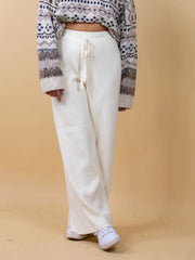 White ribbed knit palazzo trousers with drawstring waist and wide leg