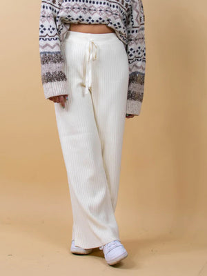 White ribbed knit palazzo trousers with drawstring waist and wide leg