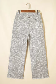 Chic high-waisted leopard print jeans in light grey with a raw hem and relaxed fit.