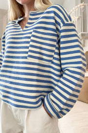Textured stripe henley top in peacock blue with a chest pocket and v-neck.