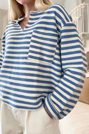 Textured stripe henley top in peacock blue with a chest pocket and v-neck.