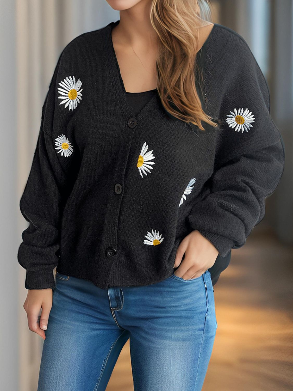 Black oversized knit cardigan with daisy embroidery and buttons