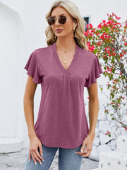 V-neck pleated flutter sleeve top in a muted coral hue, featuring a casual, relaxed fit.