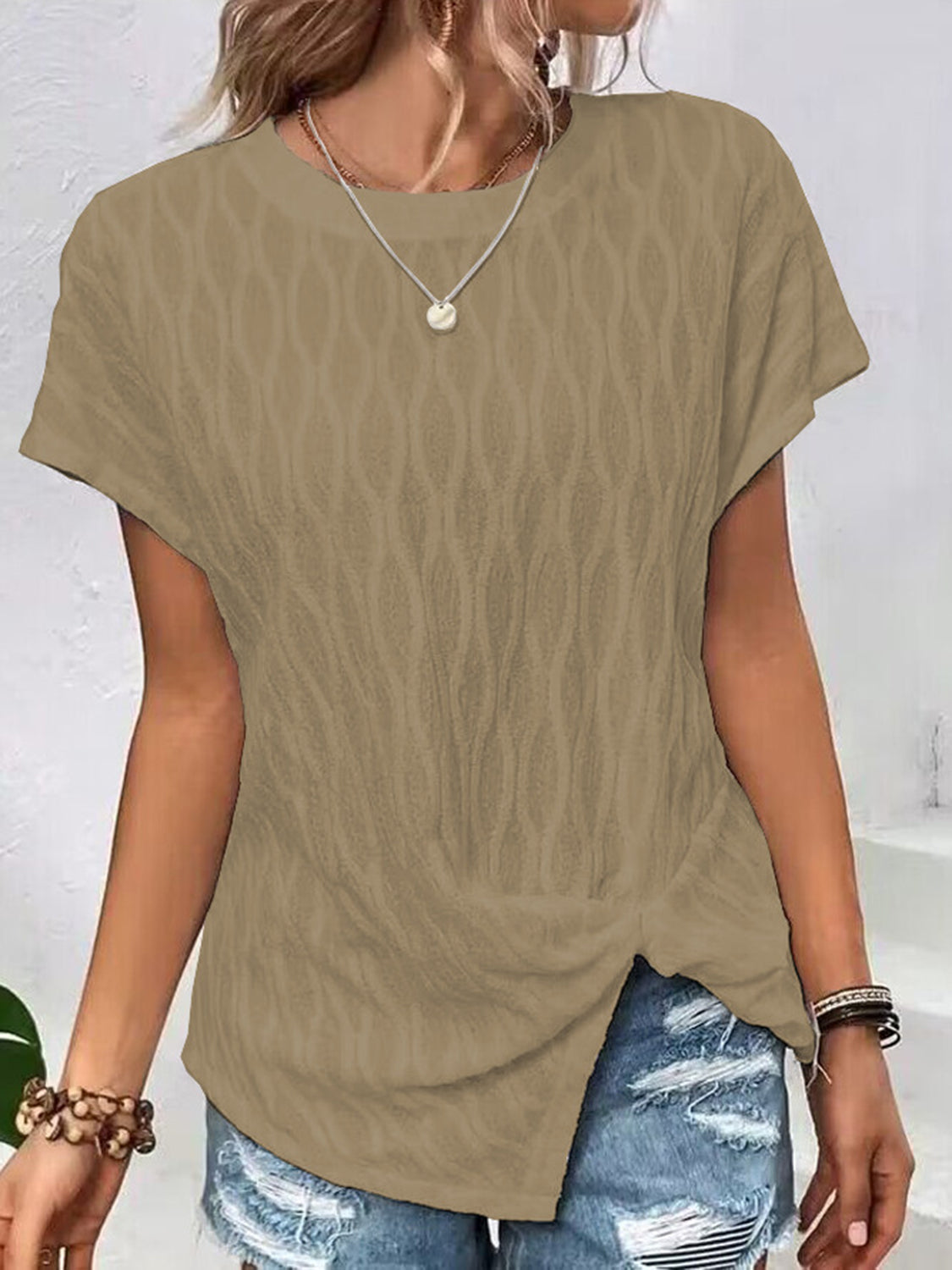 Camel textured knot-front asymmetric tee with short sleeves and a crew neck.