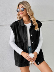 Black denim utility vest with button front and chest pockets, worn by a model.