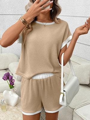 Khaki ribbed knit two-piece set with white trim, short sleeves, crew neck, and shorts with elastic waistband.