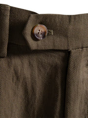 Classic pleated chino shorts in coffee with a button closure and visible stitching detail.