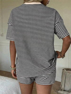 Black and white striped two-piece set with drawstring shorts and short sleeve top.