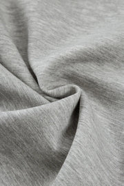 Gray heather knit fabric detail of wide-leg lounge trousers