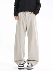 Men's beige wide-leg casual pants with a relaxed fit and belt detail.